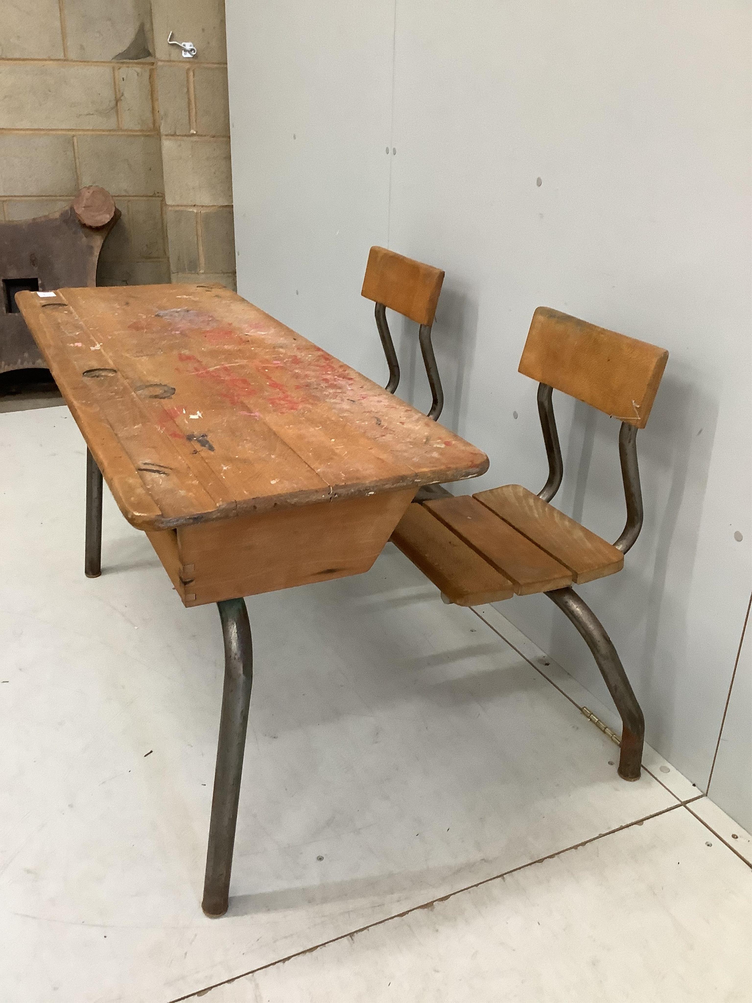 A vintage beech and tubular steel child's double desk, width 119cm, depth 79cm, height 72cm
